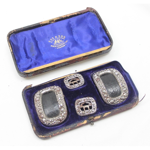 1057 - A boxed set of 4 19th century leather and bright cut steel shoe buckles, box marked for Ede & Son of... 