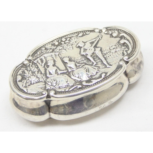 1058 - An antique silver snuff box the lid embossed with a Bucolic scene of a lute player and 2 ladies, Bir... 