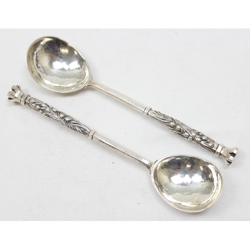 1060 - Omar Ramsden, a pair of Arts and Crafts silver spoons, London 1930, planished bowls & hexagonal stem... 