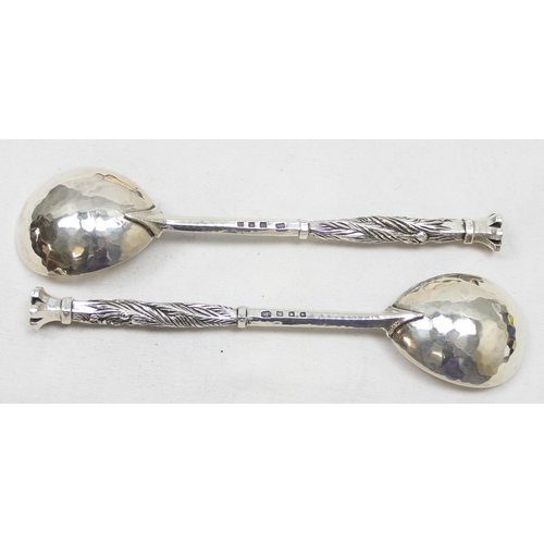 1060 - Omar Ramsden, a pair of Arts and Crafts silver spoons, London 1930, planished bowls & hexagonal stem... 