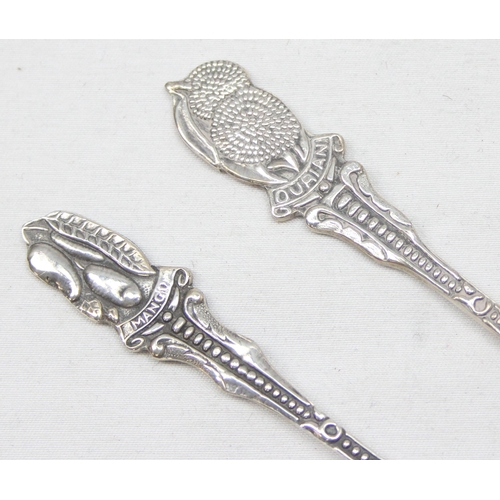 1061 - A pair of long 925 silver spoons, one terminal decorated with Mango, the other with Durian fruit, bo... 