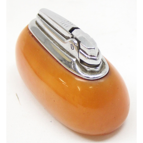 1614 - A vintage Ronson lighter with amber coloured early plastic (possibly Bakelite) body, approx 10cm wid... 