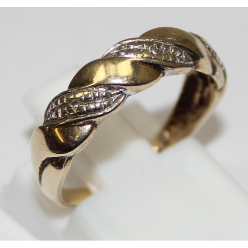 2296 - 9ct white and yellow gold diamond set twisted band ring, English hallmarks, approx size M, approx 2.... 