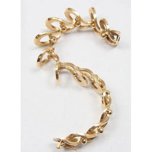 2300 - An Italian 18ct gold retro bracelet with unusual interlocking links and balls, marked FOT 750 and XR... 