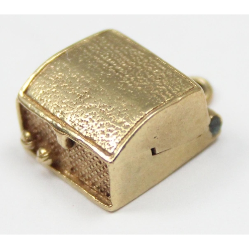 2308 - A vintage 9ct gold pendant or charm formed as a portable record player, marked and XRF confirmed, ap... 