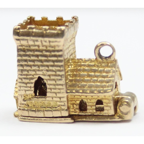 2319 - A vintage 9ct gold pendant or charm formed as a church opening to reveal a wedding scene, marked and... 