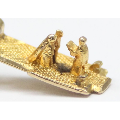 2319 - A vintage 9ct gold pendant or charm formed as a church opening to reveal a wedding scene, marked and... 