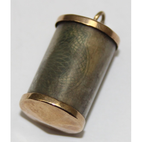 2326 - A vintage 9ct gold mounted charm with folded £1 note, marked and XRF confirmed, approx 2.81g gross