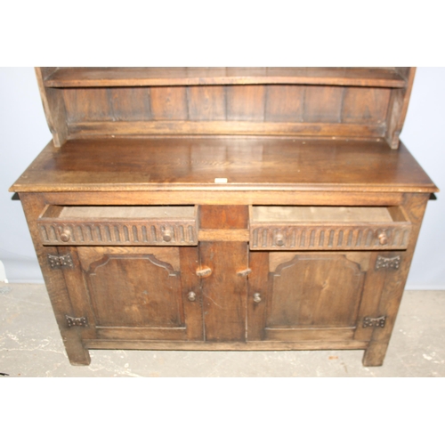 113 - A large vintage Jacobean style oak dresser, approx 146cm wide x 48cm deep x 194cm tall