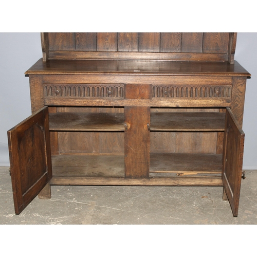 113 - A large vintage Jacobean style oak dresser, approx 146cm wide x 48cm deep x 194cm tall