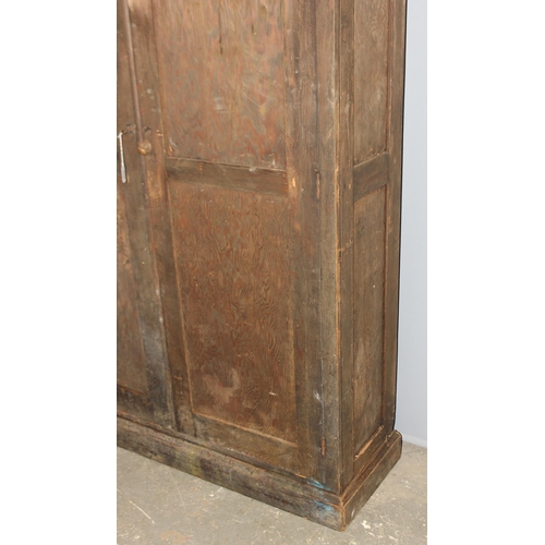 114 - A large antique stained pine hall cupboard made by The Oxford Cabinet Co of Marlborough Rd, Oxford, ... 