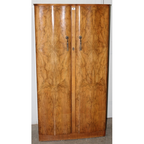 37 - A mid-century walnut veneered wardrobe with interior drawers and compartments, approx 93cm wide x 61... 