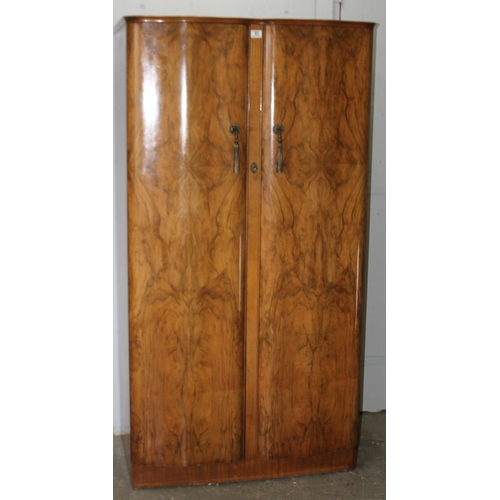 37 - A mid-century walnut veneered wardrobe with interior drawers and compartments, approx 93cm wide x 61... 