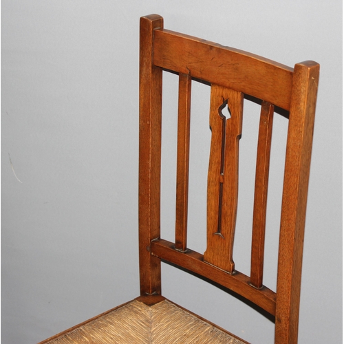 100 - 2 Arts & Crafts period light oak and rush-seated chairs