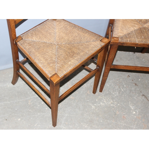 100 - 2 Arts & Crafts period light oak and rush-seated chairs