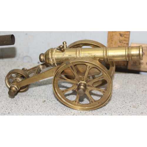 1537 - WWI tin plate toy model field cannon in military khaki colour with sprung loaded firing mechanism an... 