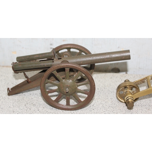 1537 - WWI tin plate toy model field cannon in military khaki colour with sprung loaded firing mechanism an... 