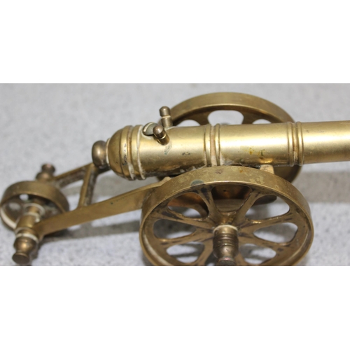 1537 - WWI tin plate toy model field cannon in military khaki colour with sprung loaded firing mechanism an... 