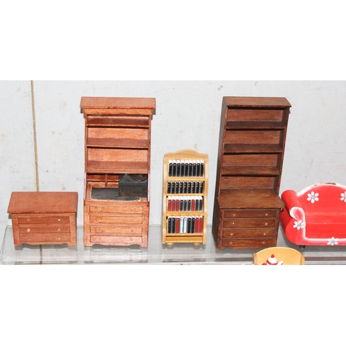 1538 - A collection of mixed period dolls house wooden furniture with other miniature items, includes an Ar... 