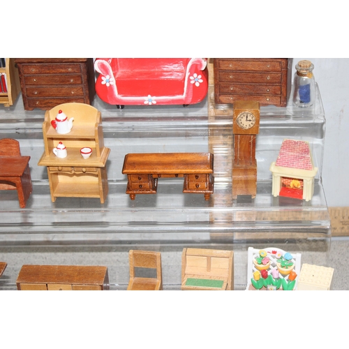 1538 - A collection of mixed period dolls house wooden furniture with other miniature items, includes an Ar... 