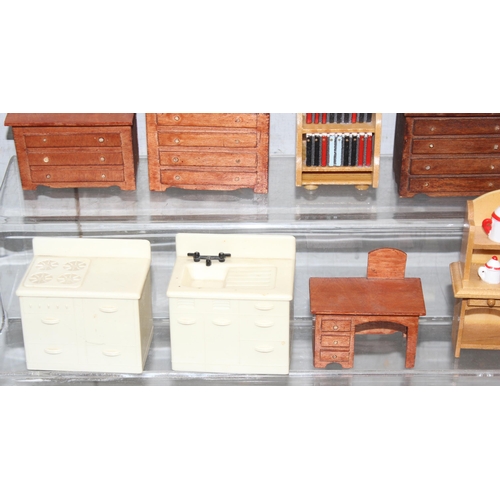 1538 - A collection of mixed period dolls house wooden furniture with other miniature items, includes an Ar... 