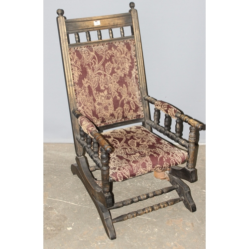 16 - A late 19th or early 20th century American rocking chair