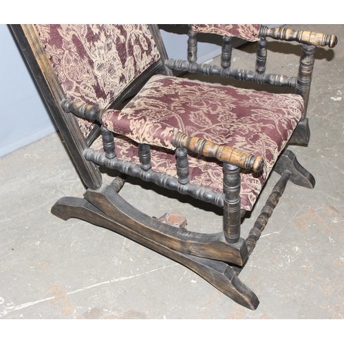 16 - A late 19th or early 20th century American rocking chair