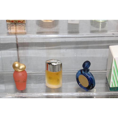 1647 - Collection of perfume samples including Moschino, Salvador Dali, Ted Lapidus, and a partly used Lanc... 