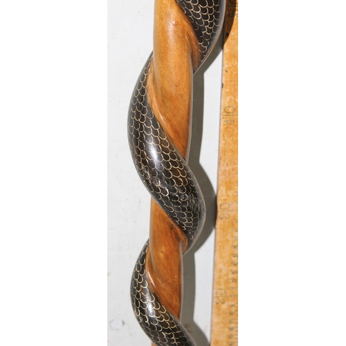 1757 - Hand carved and painted realistic entwined Cobra wooden walking stick with meta tip, approx 100cm ta... 