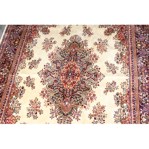 208 - A large red and cream ground Tabriz style rug with Tiznit label, approx 138 cm x 206 cm