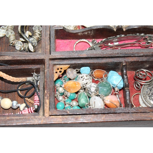 2334 - A vintage wooden jewellery box and contents to inc a number of silver earrings and a silver christen... 