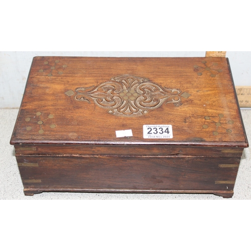 2334 - A vintage wooden jewellery box and contents to inc a number of silver earrings and a silver christen... 