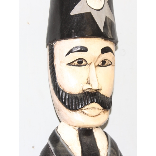 279 - Large tall hand carved and painted novelty standing policeman with radio on wooden plinth base, appr... 