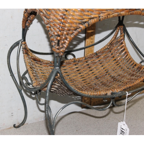 281 - An interesting raised wicker basket on wrought iron stand, approx 55cm tall