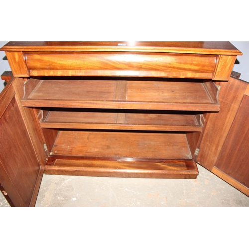 117 - A 19th century mahogany sideboard with shelf over a hidden drawer and a cupboard, approx 120cm wide ... 