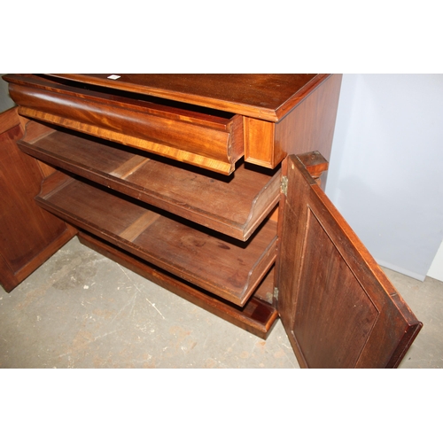 117 - A 19th century mahogany sideboard with shelf over a hidden drawer and a cupboard, approx 120cm wide ... 