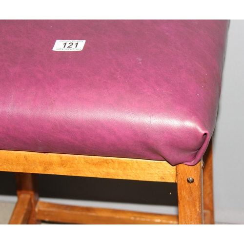 121 - 2 purple upholstered stools with wooden bases, approx 57cm tall