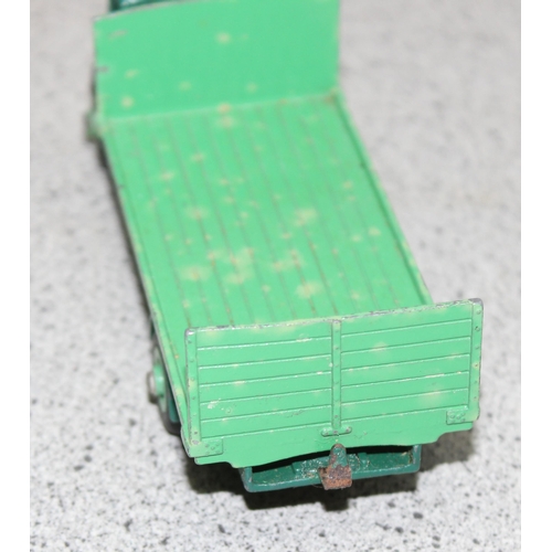 1548 - A vintage Dinky Toys 513 Guy Flat Truck with Tailboard, 2 tone green, in original box