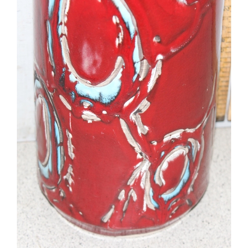 1654 - A large retro Poole pottery vase, blue circles on a deep red ground, approx 40cm tall, marked to bas... 