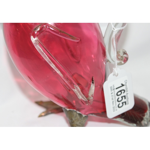 1655 - A rare cranberry glass and silver plate mounted decanter or claret jug formed as a duck, the feet ma... 