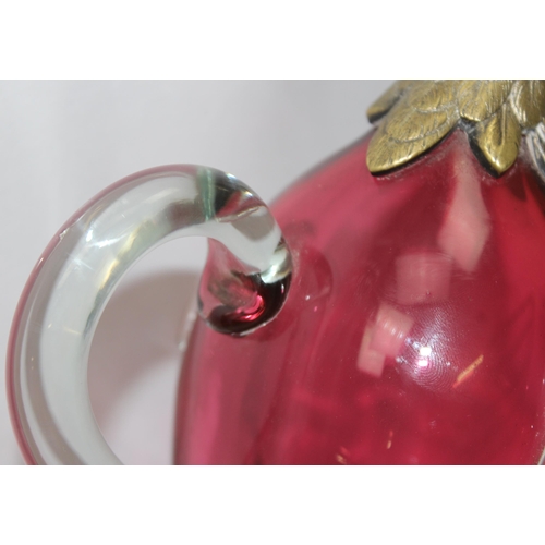 1655 - A rare cranberry glass and silver plate mounted decanter or claret jug formed as a duck, the feet ma... 