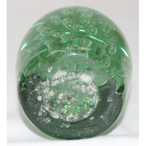 1658 - A classic style 19th century Victorian green glass dump paperweight with bubble design, approx 10cm ... 