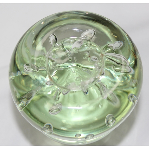 1659 - An unusual green glass dump paperweight of 3 stepped design with random bubbles, likely 19th century... 