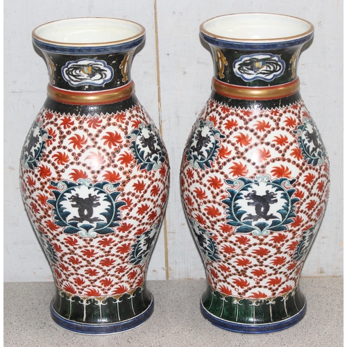 1665 - A large decorative pair of Chinese porcelain vases decorated in polychrome enamel, both bearing seal... 