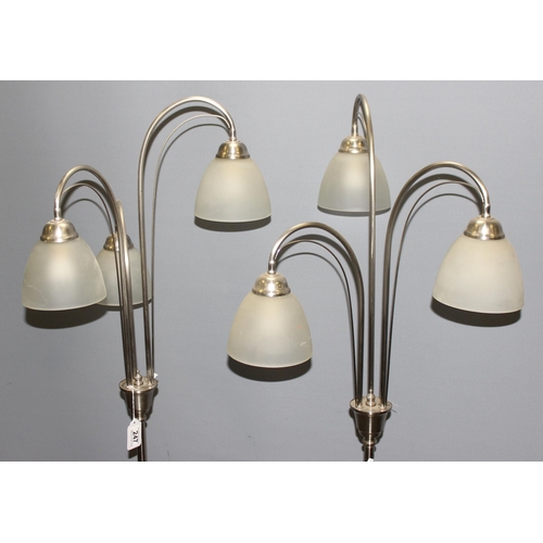 247 - A pair of chrome based down lighter lamps, each approx 162cm tall