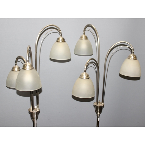 247 - A pair of chrome based down lighter lamps, each approx 162cm tall