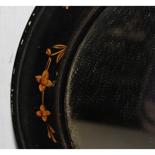 400 - An early 20th century oval wall mirror with Chinoiserie lacquer decoration, approx 78cm x 52cm