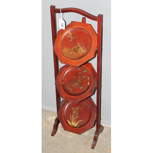 106 - An early 20th century Japanese red lacquer folding 3 tier cake stand, approx 83cm tall