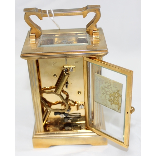 1333 - Mappin & Webb, a 20th century brass and glass cased carriage clock with English made mechanical move... 