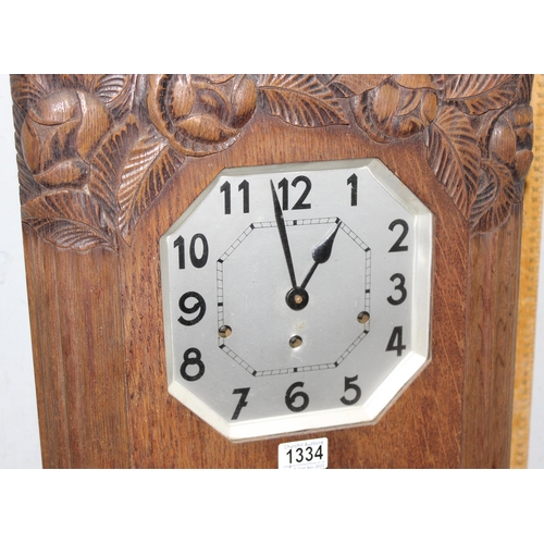 1334 - Large French oak cased Art Deco wall clock with carved details, approx 73cm H x 38cm W x 17cm D